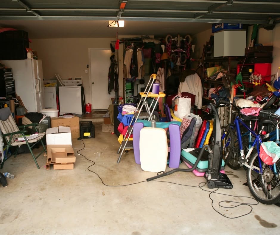 Cluttered garage filled with household items and bicycles