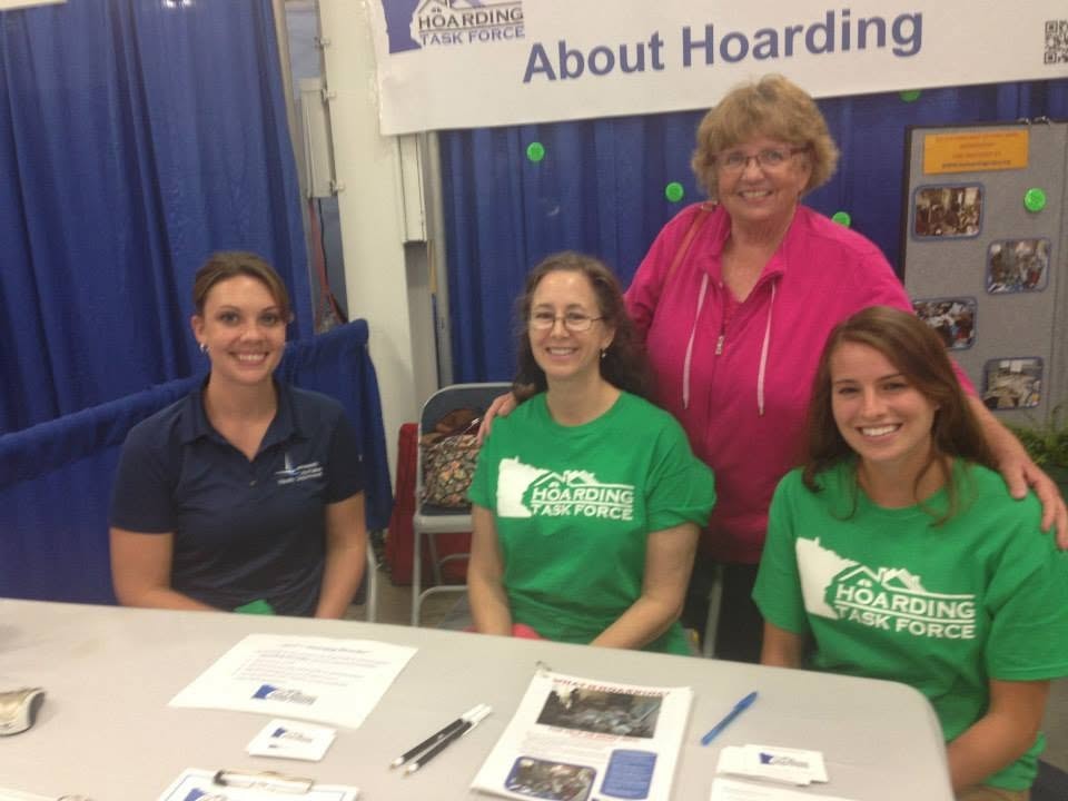 MNHTF volunteers seated at Shred Right event booth table